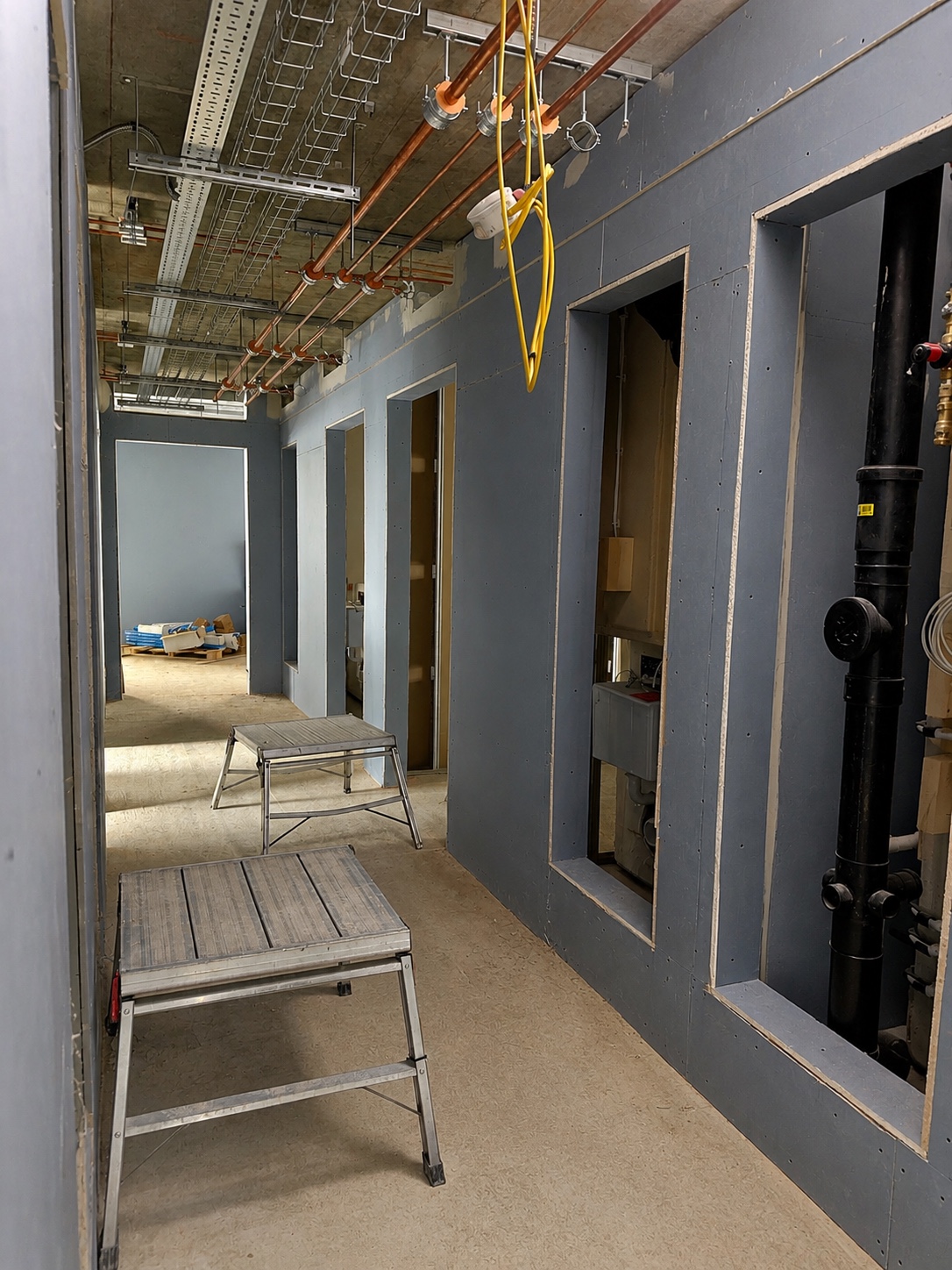 Boarded partition doorway details during interior works