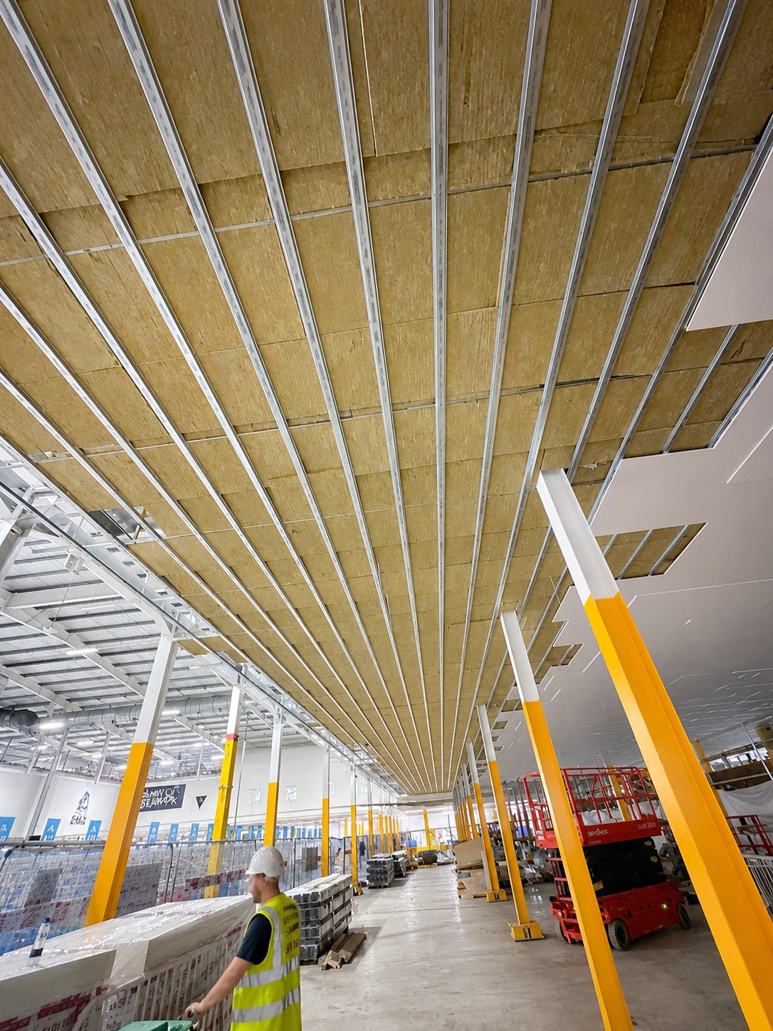 Ceiling insulation fitted between metal framework