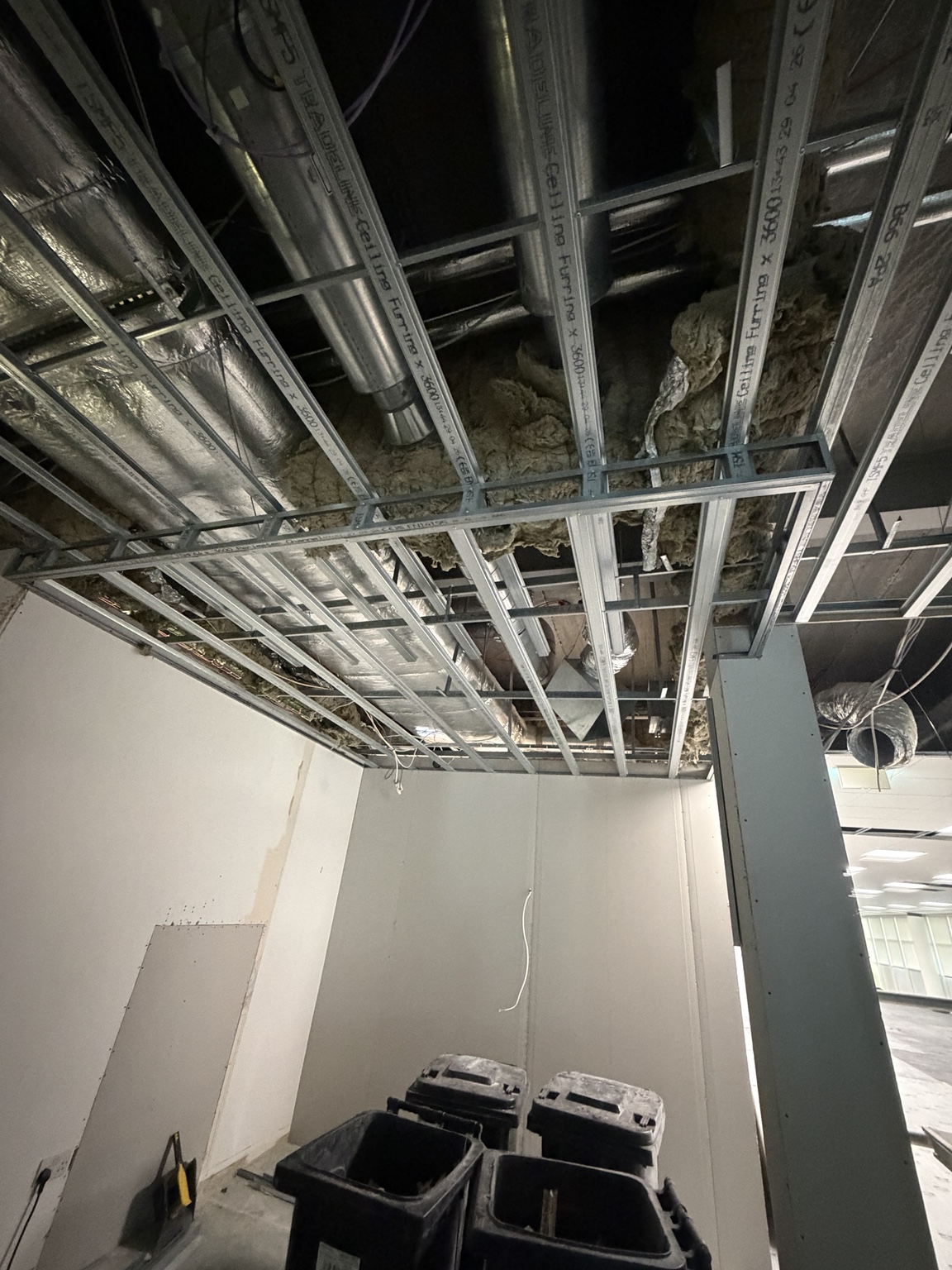 Partition boarding and ceiling framework in progress