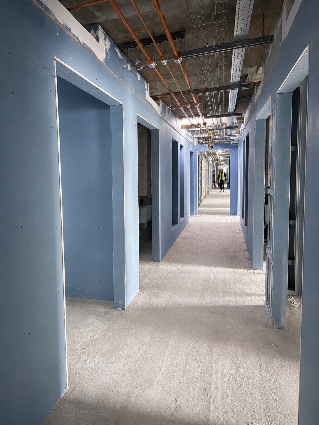 Boarded corridor partitions with doorway openings